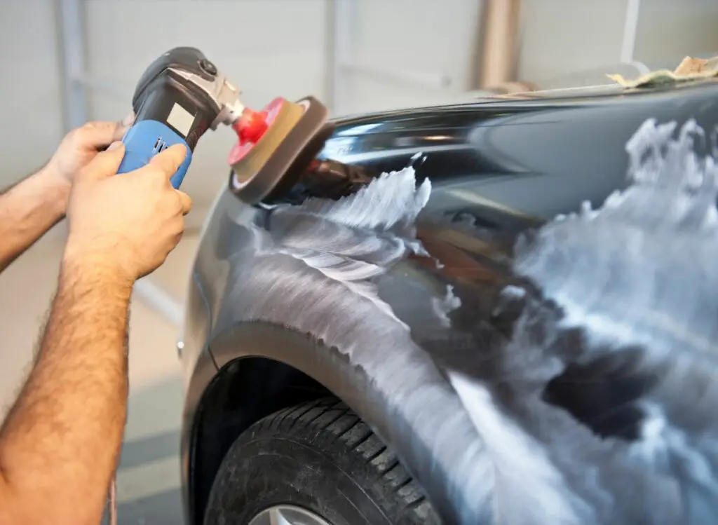buffing the car with an electric buffer