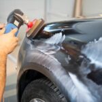 buffing the car with an electric buffer