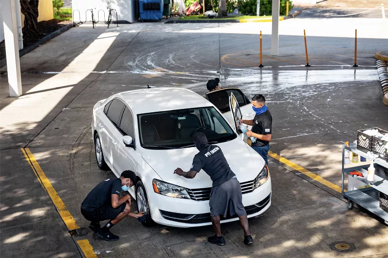 Car detailing team at Prestige Auto Spa in Miami.