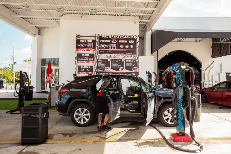 Car interior detailing with carpet shampooing at Prestige Auto Spa Miami.