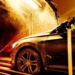 Car being washed with foam soap exterior cleaning