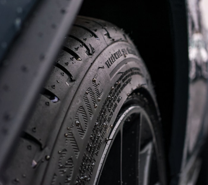 Close up of tire tread pattern with water droplets after rain