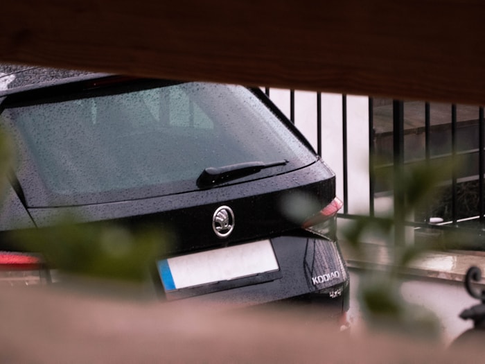 Car windshield with wiper in rain